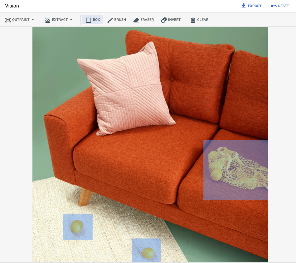 Gambar dasar contoh sofa merah ditampilkan, dengan area yang di-masking ditentukan untuk sekantong lemon di sofa dan dua lemon di karpet.